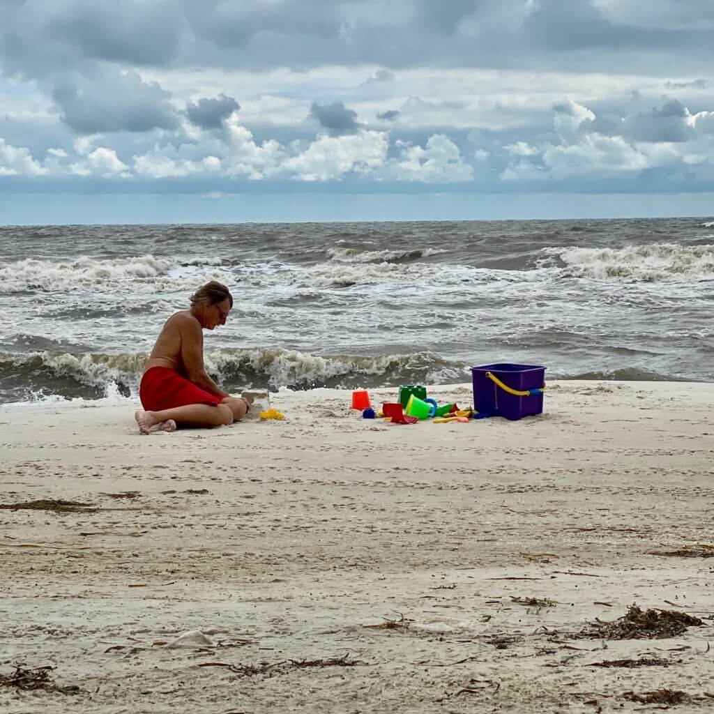 Man playing in the sand