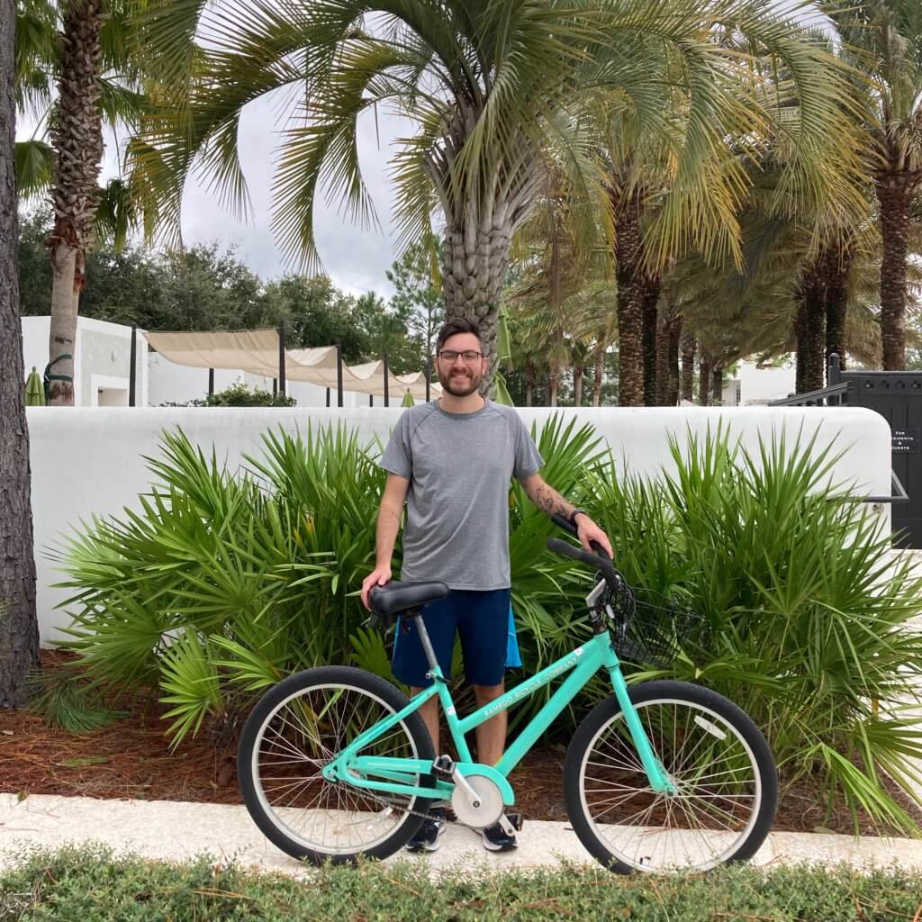 Man standing next to bike
