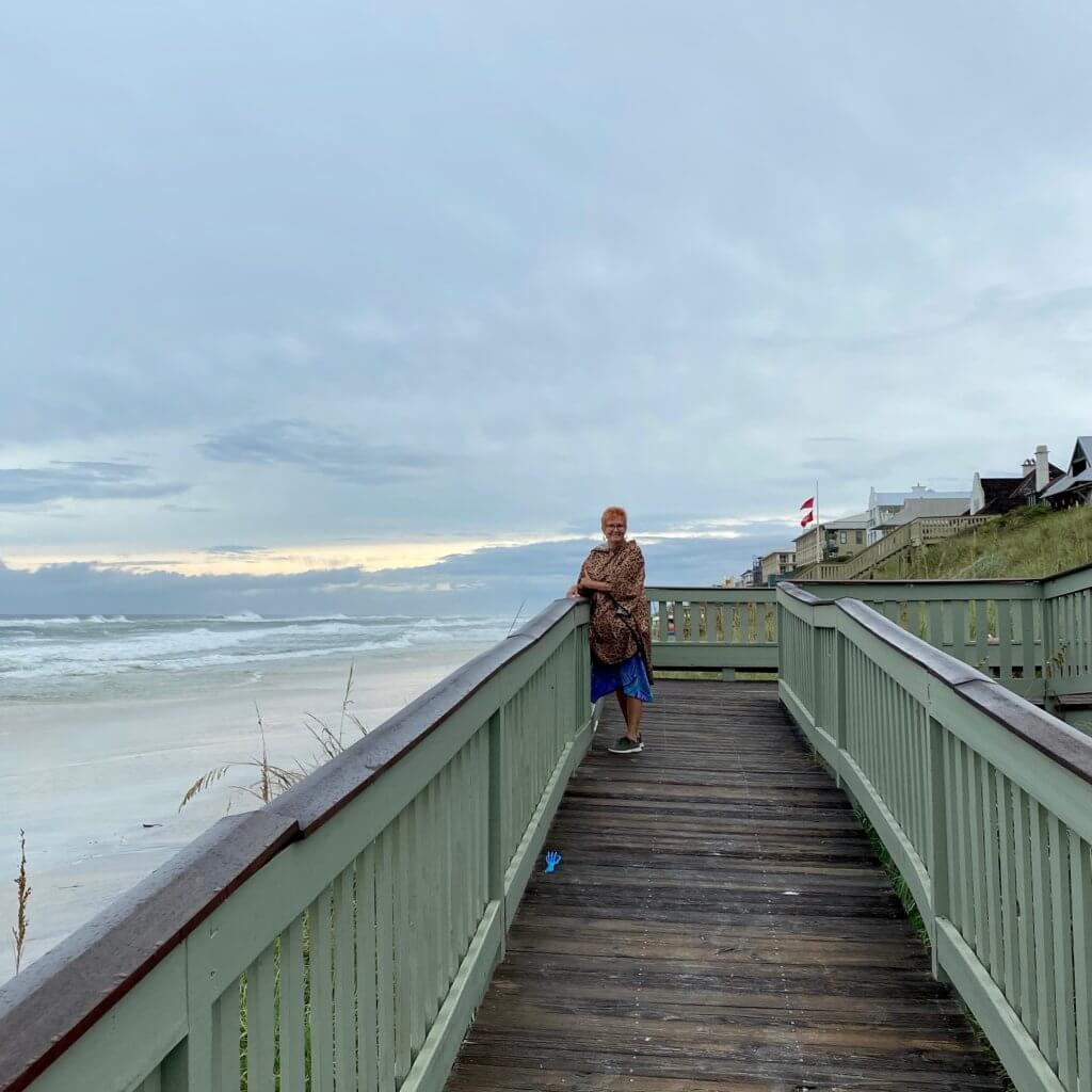 Girl standing on a boardwalk