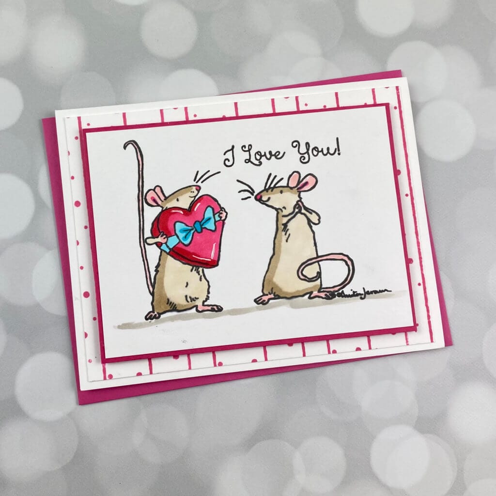 2 mice looking at each other on a valentines day card