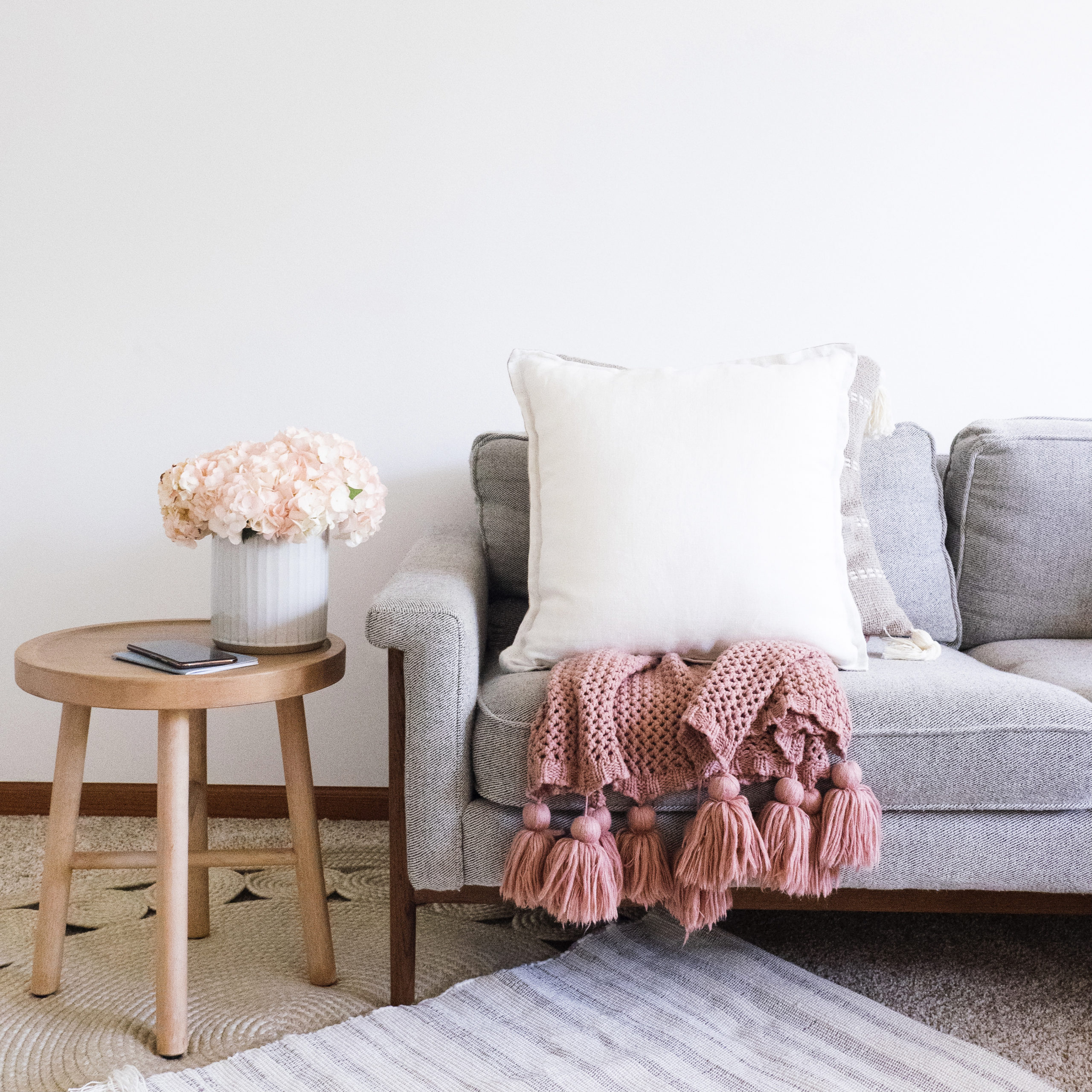 national clean your room day. sofa, chairs and pink throw in a living room