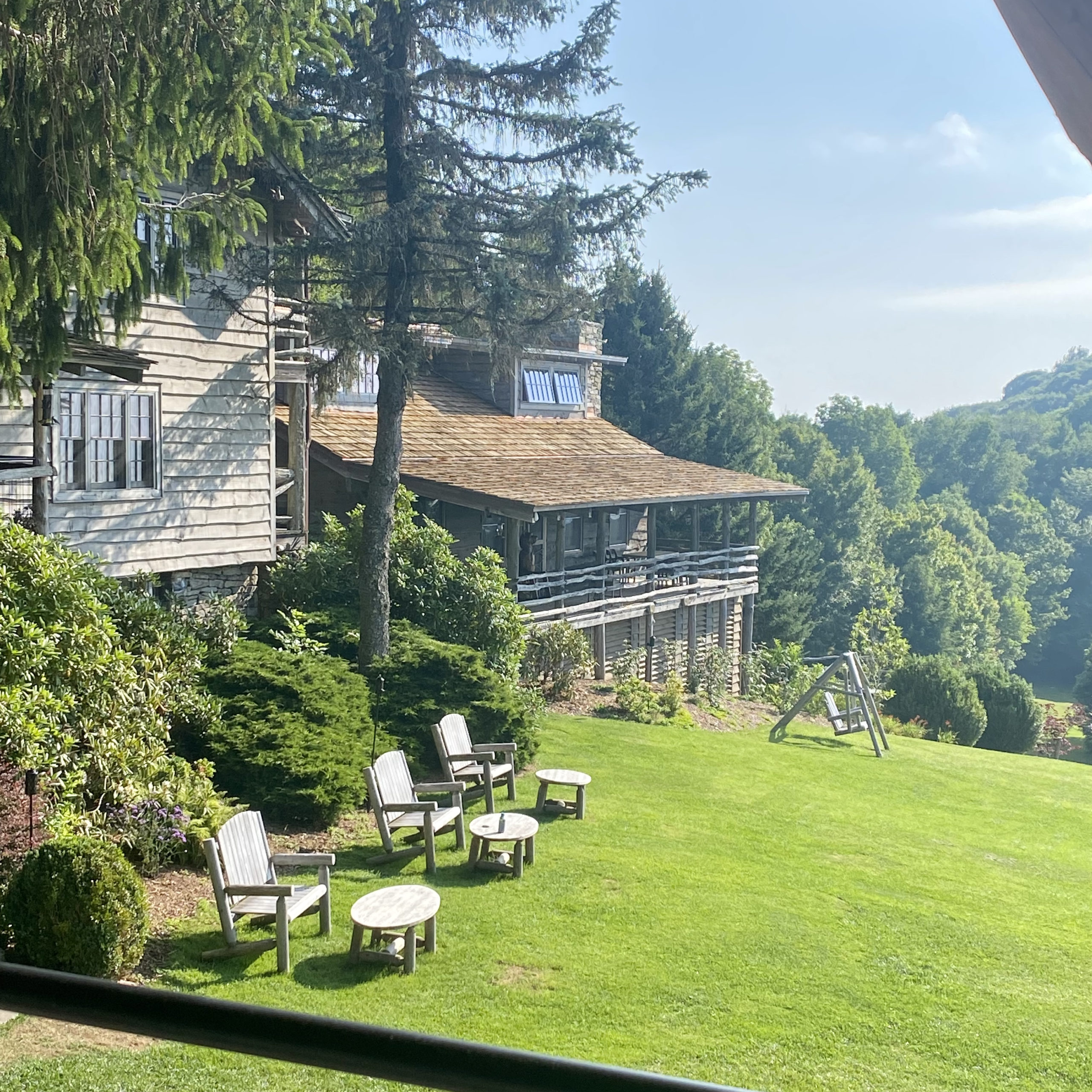 view from the front porch of the Swag. The hotel and the mountains in the background | The Swag Hotel | Positively Jane