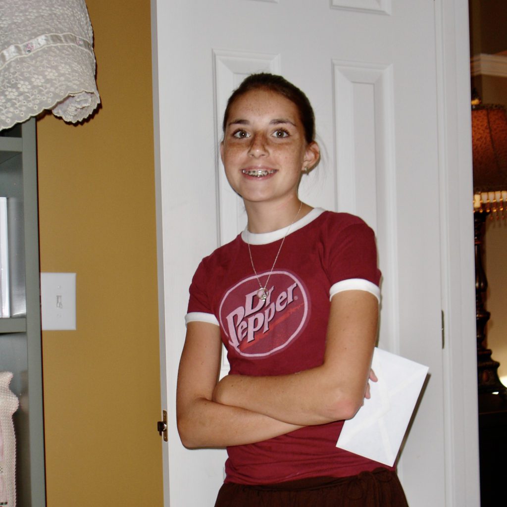 nicole wearing a doctor pepper shirt |how i taught my daughter to budget | kids and budgets | Positively Jane