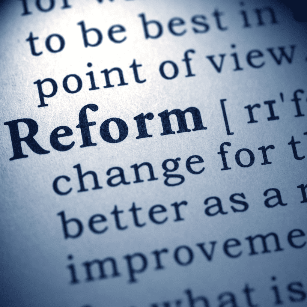 the word reform highlighted on a book