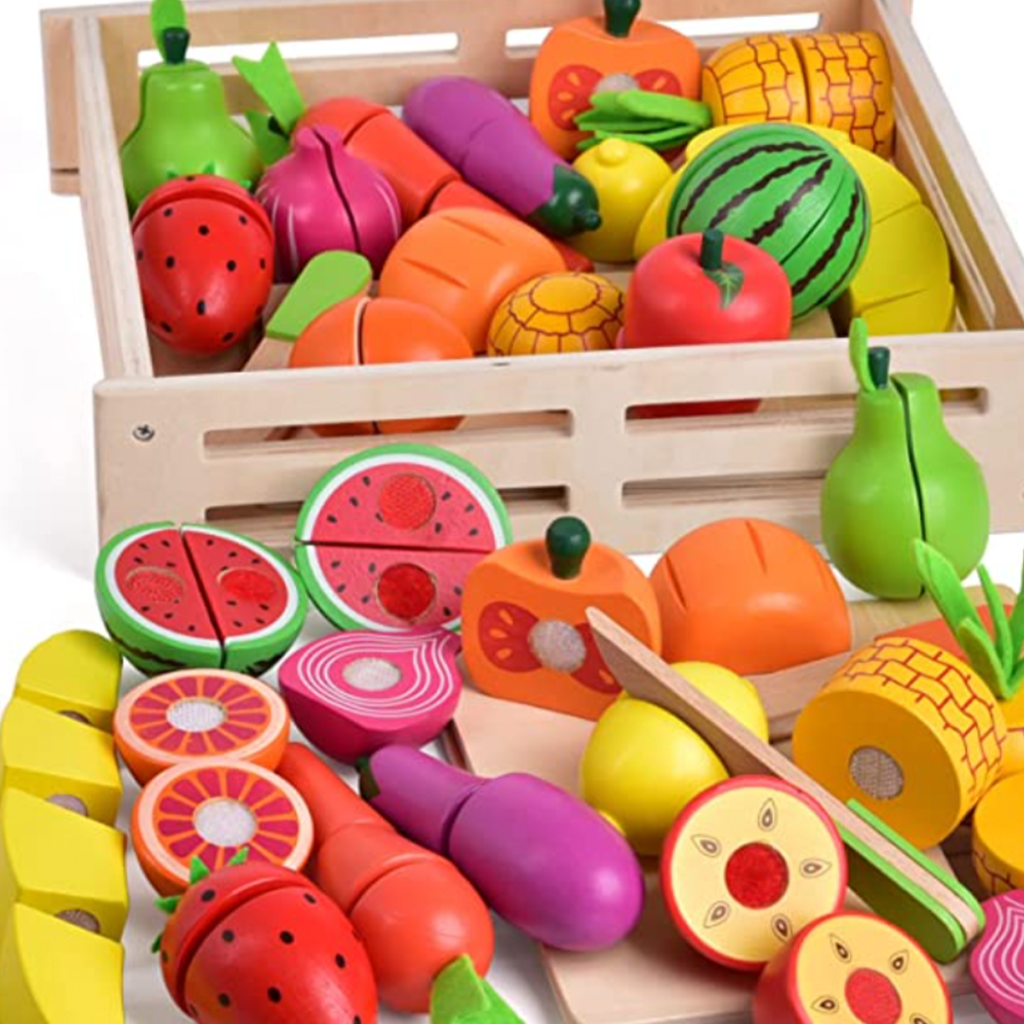 Wooden play fruit for kids in a wooden crate